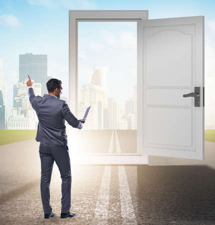 Businessman in front of door in business opportunities conceptの写真素材