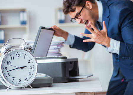 Businessman making copies in copying machine