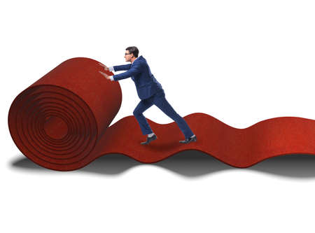 The businessman on red carpet isolated white backgroundの写真素材