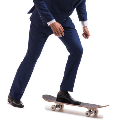Businessman riding skateboard isolated on white backgroundの写真素材