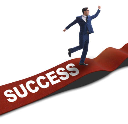 Businessman on red carpet isolated white backgroundの写真素材