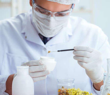 Chemist mixing perfumes in the lab