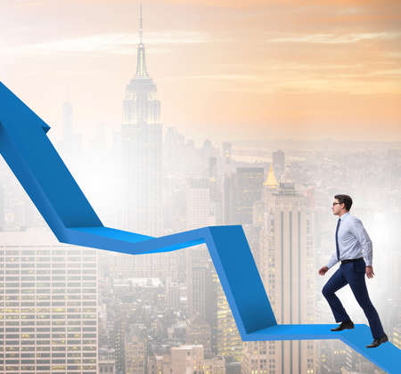 Businessman supporting growtn in economy on chart graphの写真素材