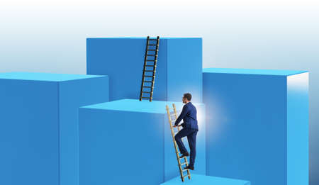 Businessman climbing blocks in challenge business conceptの写真素材