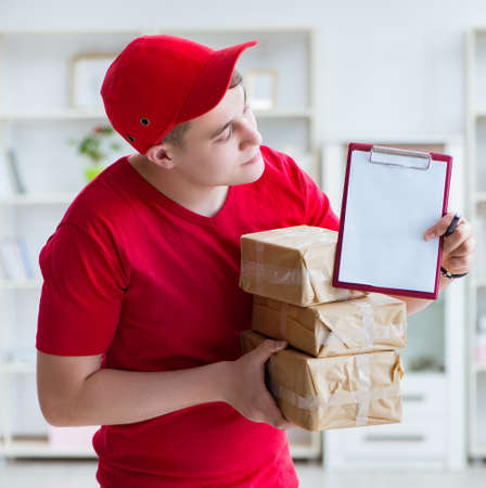 Post man delivering a parcel packageの写真素材