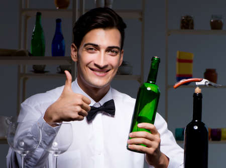 Professional sommelier tasting wine in restaurantの写真素材