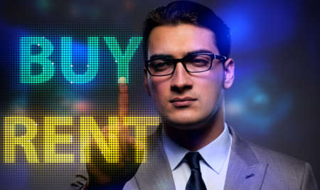 Businessman facing dilemma of buying versus rentingの写真素材