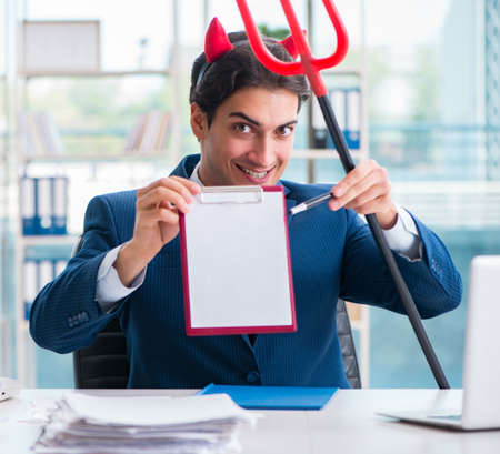 Devil angry businessman in the office