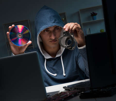 Hacker hacking computer at nightの写真素材