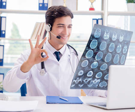 Young male doctor in telehealth concept