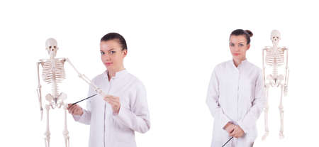 Doctor with skeleton on white