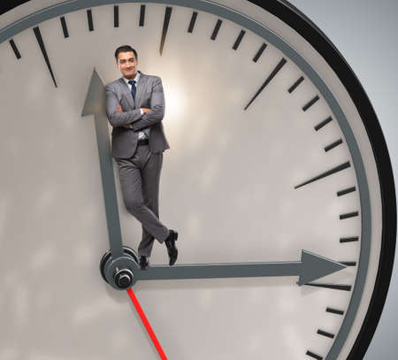 Businessman in time management conceptの写真素材
