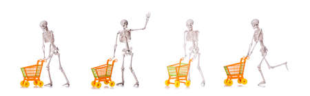 Skeleton with shopping cart trolley isolated on whiteの写真素材