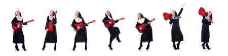 Nun playing guitar isolated on whiteの写真素材