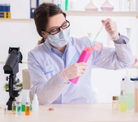 Lab chemist checking beauty and make-up productsの写真素材