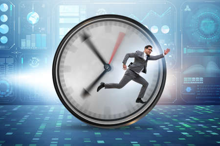Businessman employee in time management conceptの写真素材