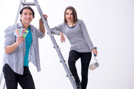 Young family doing renovation at homeの写真素材