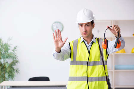 Young male architect working in the officeの写真素材