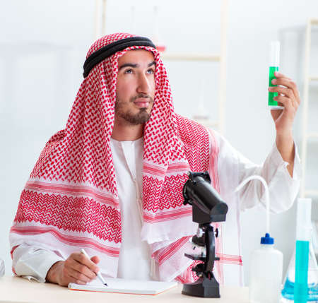 Arab chemist working in the lab officeの写真素材