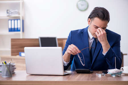 Young male businessman working in the officeの写真素材