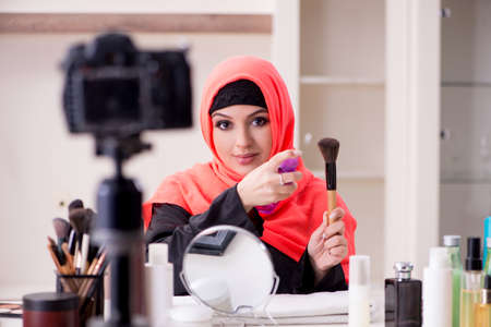 Beauty blogger in hijab recording video for her blogの写真素材