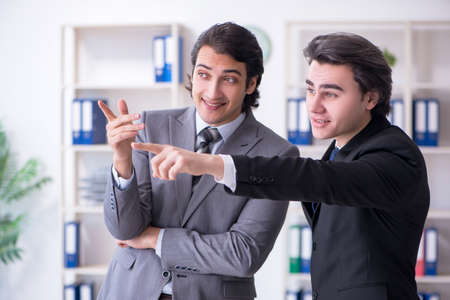 Two young businessmen meeting in the officeの写真素材