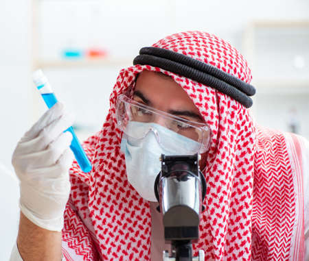 Arab chemist working in the lab officeの写真素材