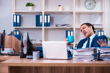 Young handsome businessman working in the officeの写真素材
