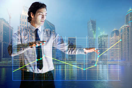 Businessman controlling the market with strings
