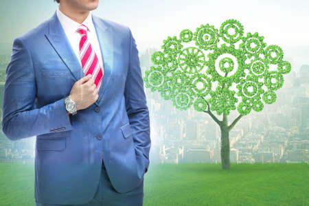 Green energy anc ecology concept with businessman