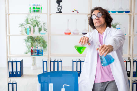 Funny male chemist working in the labの写真素材