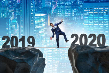 Businessman on tight rope from year 2019 to 2020