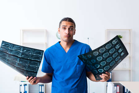 Young male doctor working in the clinic