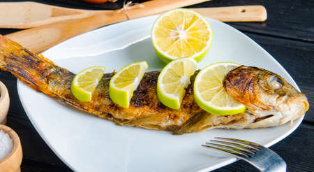 The fried fish served on the plate