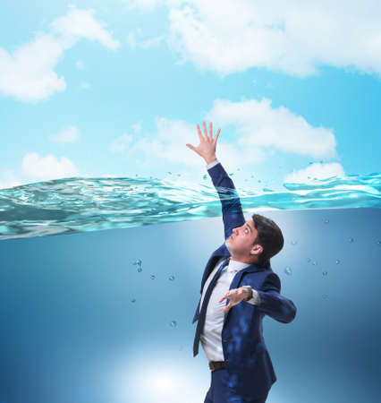 Drowning businessman in insolvency and bankruptcy conceptの写真素材