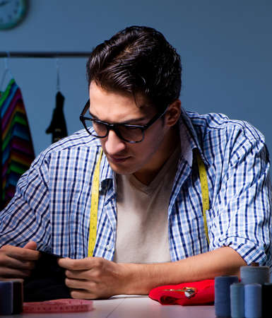 Male tailor working in sewer shop