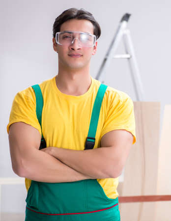 Worker wearing protective goggles at construction siteの写真素材