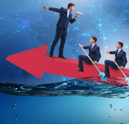 Teamwork concept with businessmen on boatの写真素材