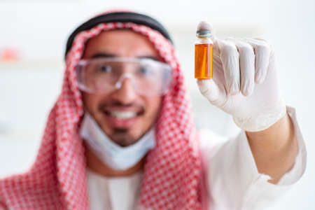 Arab chemist working in the lab officeの写真素材