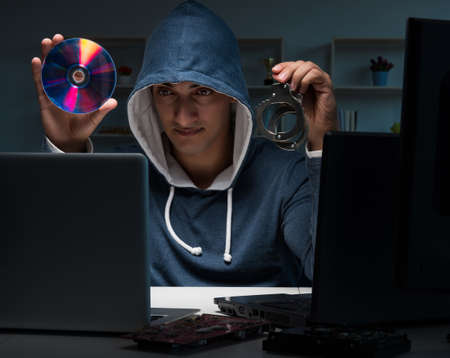 Hacker hacking computer at night