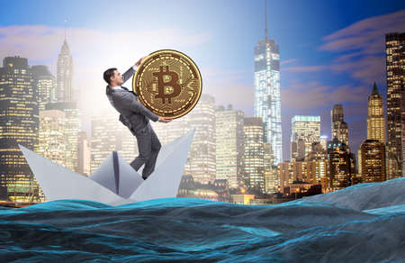 Businessman rowing on dollar boat in business financial conceptの写真素材