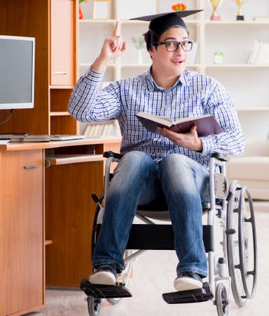 Disabled student studying at home on wheelchairの写真素材
