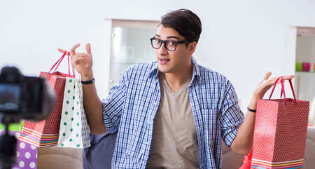 Male fashion blogger recording video for vlogの写真素材