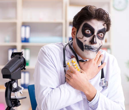 Scary monster doctor working in labの写真素材