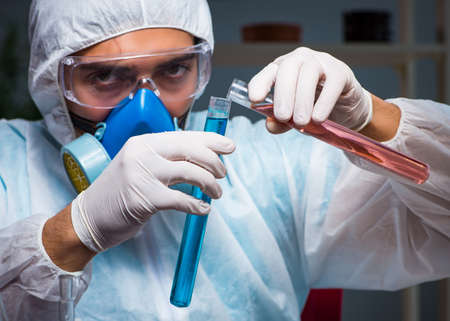 The young make scientist working with dangerous hazardous substaの写真素材
