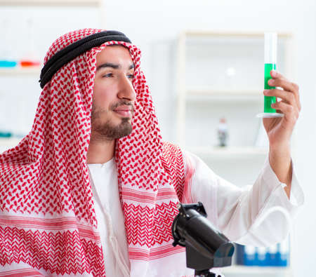 Arab chemist working in the lab officeの写真素材