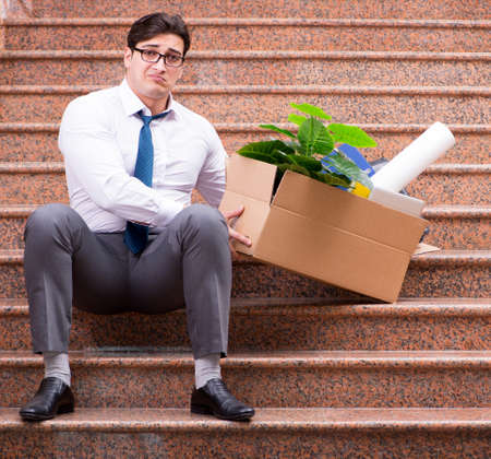 Young businessman on the street after dismissalの写真素材