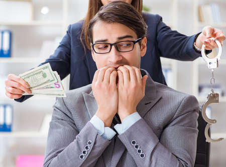 Businessmanbeing offered bribe for breaking law