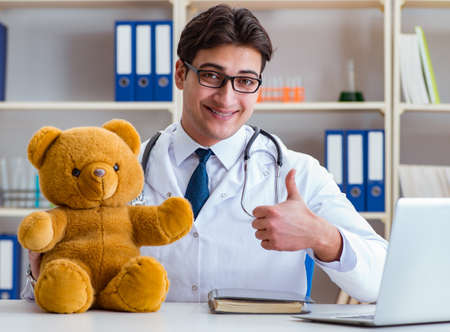 Doctor veterinary pediatrician holding an examination in the offの写真素材