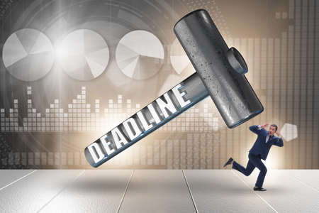 Businessman failing to meet the deadlineの写真素材